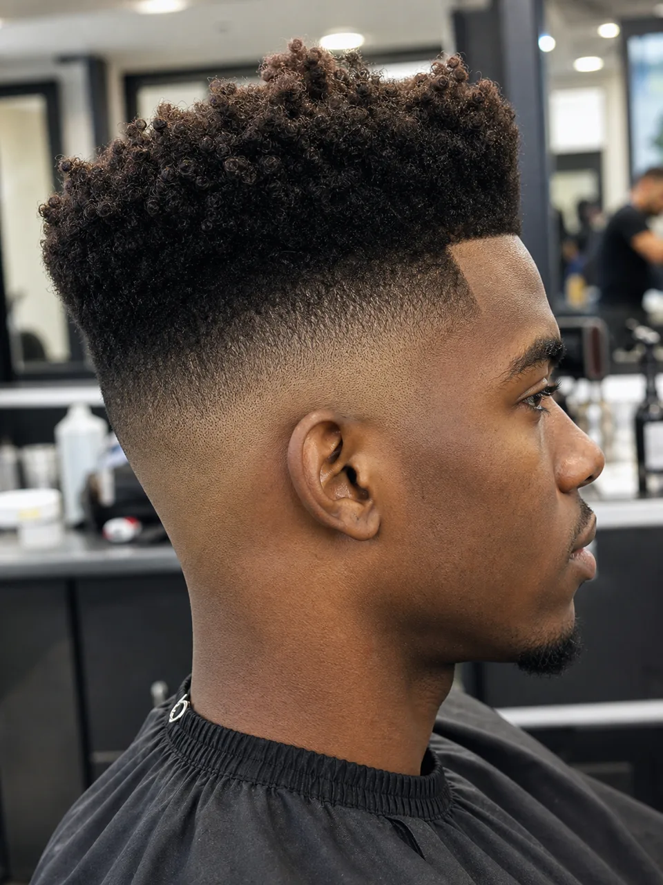 High top high skin fade haircut with sharp lineup and side fade